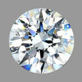 A round brilliant-cut diamond shown from the top, displaying its intricate faceted pattern with white, gray, and subtle blue iridescent reflections on a solid gray background.