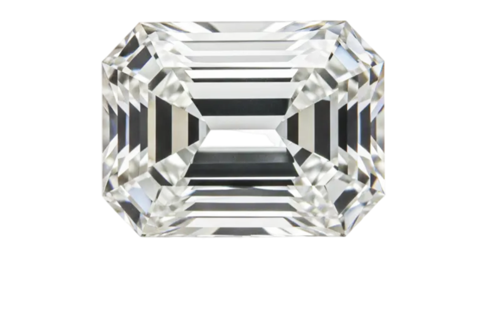 An emerald-cut clear gemstone with sharp geometric facets, isolated on a solid white background.