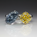 FANCY DARK GRAY-BLUE OVAL AND fANCY VIVID YELLOW on a dARK GRAY BACKGROUND