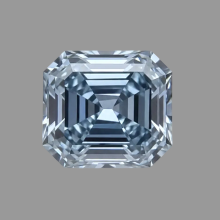 An emerald-cut loose gemstone with a light blue-gray color and clear faceted edges, centered on a solid gray background.