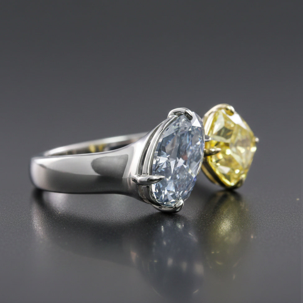 FANCY DARK GRAY-BLUE OVAL AND fANCY VIVID YELLOW on a dark gray background