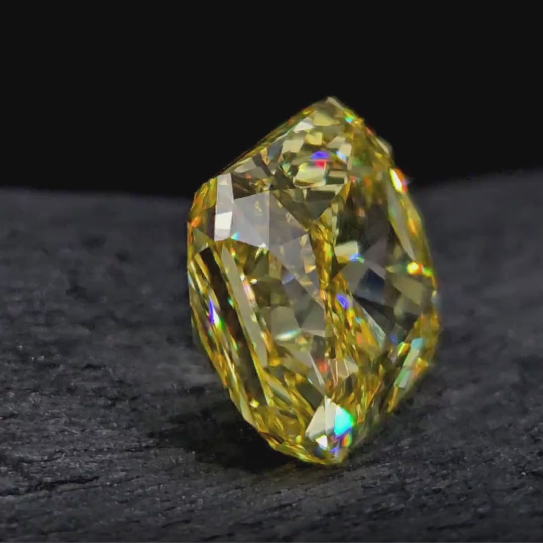 8ct Fancy Vivid Yellow Radiant On a dark background